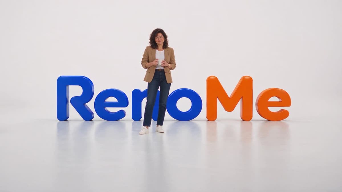 The homeowner from our ads in a bright studio in front of the RenoMe logo.
