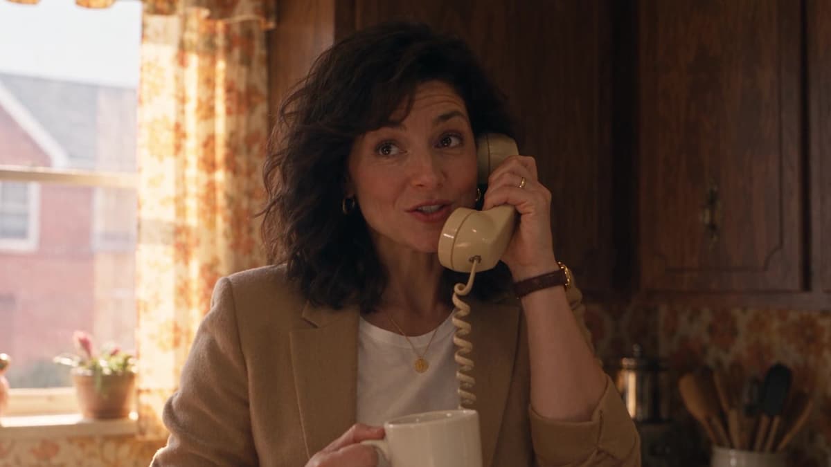 The homeowner from our ads on a rotary phone in her kitchen.