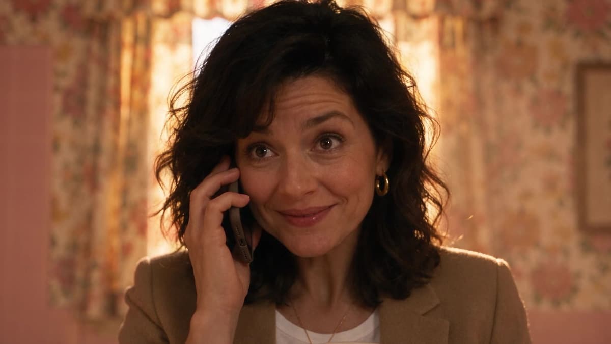 The homeowner from our ads smiling on the phone.